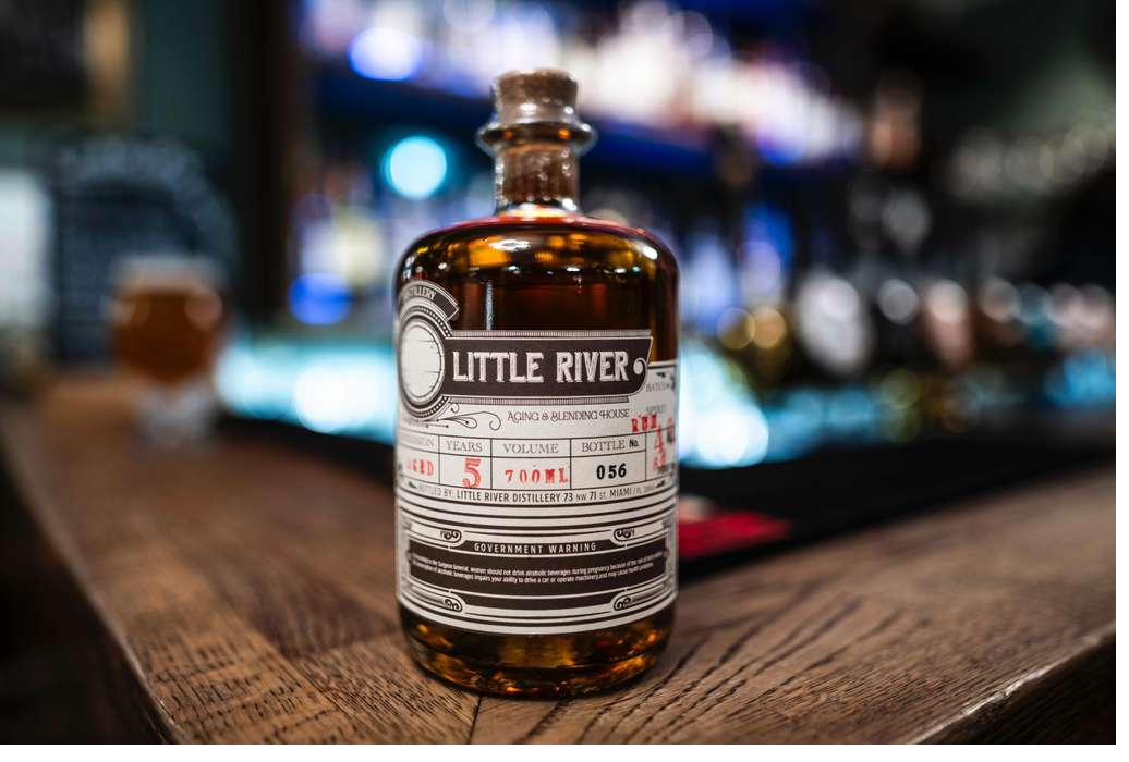 Close-up of the Little River 5-year rum bottle on the bar