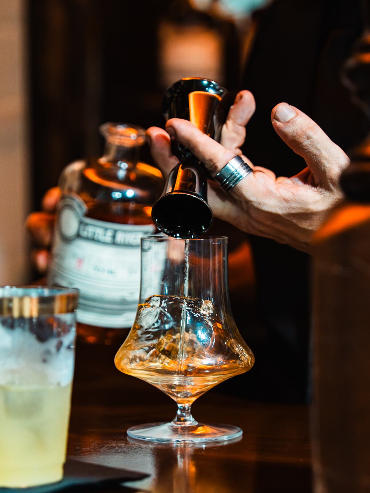 A pour of Little River rum into a tasting glass at the bar