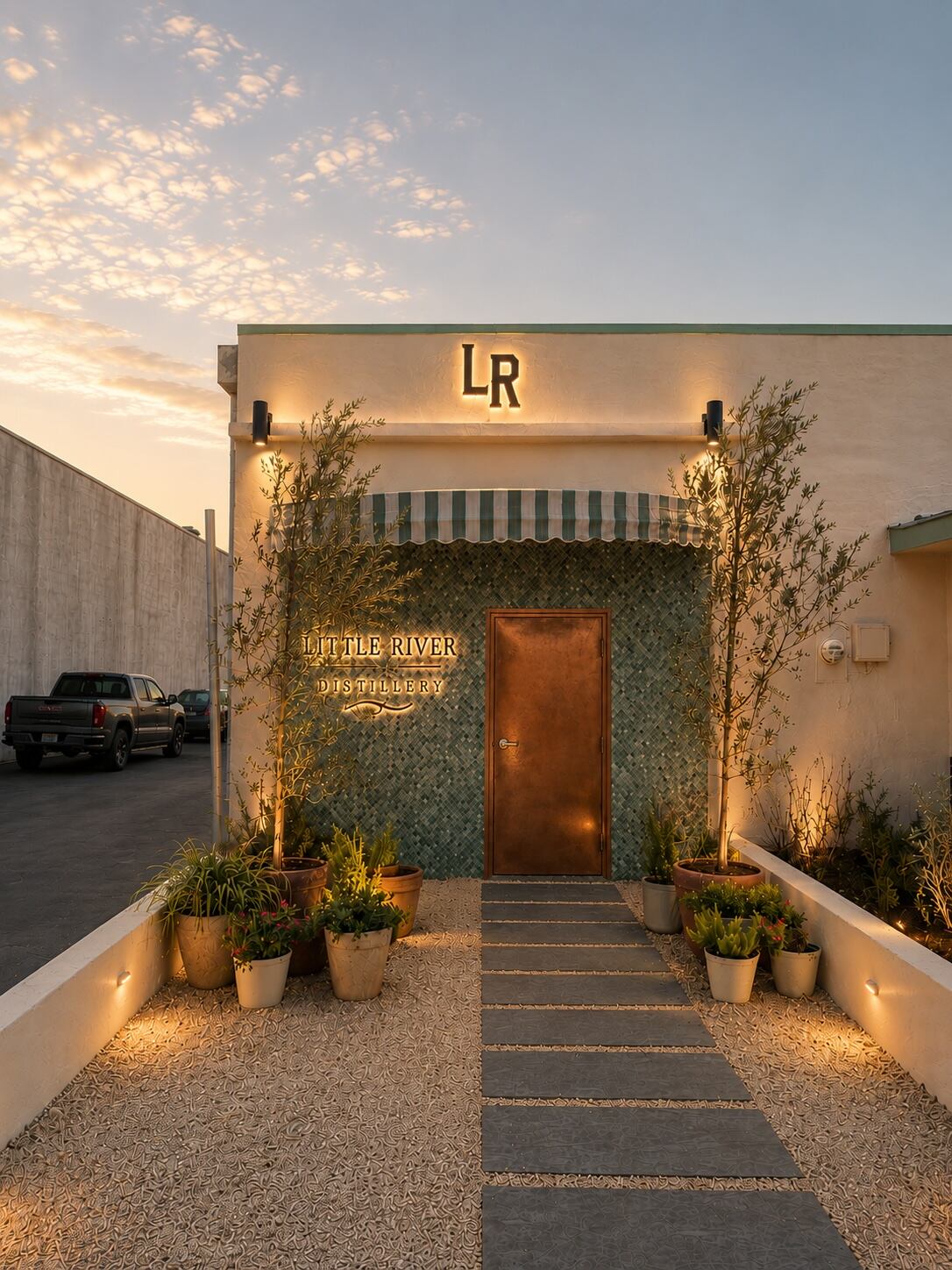 The exterior entrance to Little River Distillery at sunset
